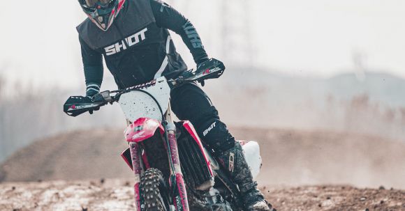 Moto Riding - Man Riding Motocross Dirt Bike on Mud